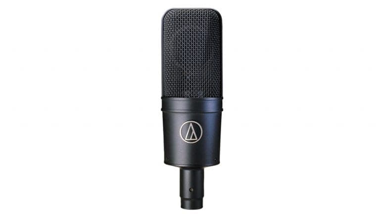 audio technica 4033a large diaphragm condenser microphone front shot with black housing, grille, and AT logo