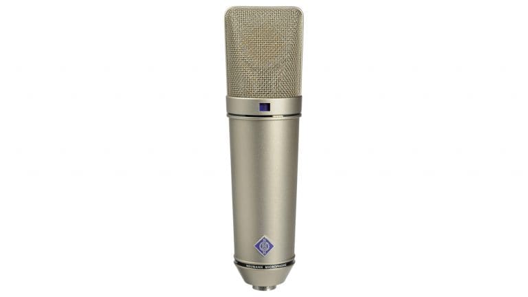 neumann u87ai large diaphragm condenser microphone front shot with gold housing and grille and Neumann logo