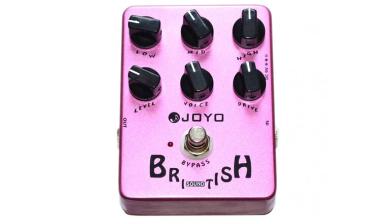 joyo british sound pedal with purple enclosure, black control knobs and text