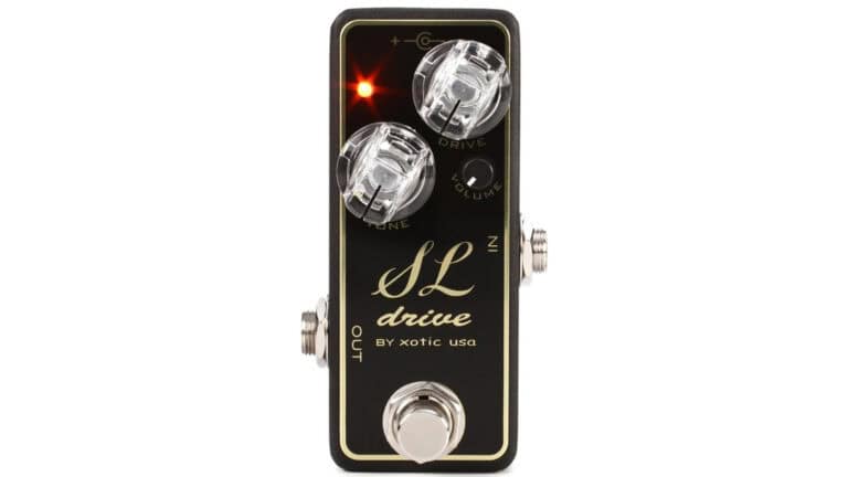 xotic effects sl drive mini pedal with black enclosure, clear control knobs, and script text