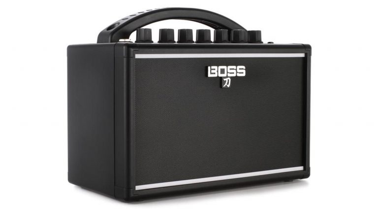 boss katana mini 7 guitar amp with black enclosure, black grille cloth, white boss logo, and two silver runners on top and bottom of grille