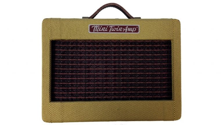 fender mini 57 twin guitar amp, yellow tweed enclosure, brown grille cloth, and fender logo