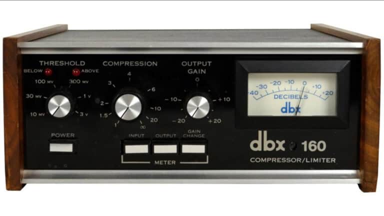 universal audio dbx 160 compressor and limiter plugin GUI with black faceplate, wood panel sides, black control knobs, VU meter