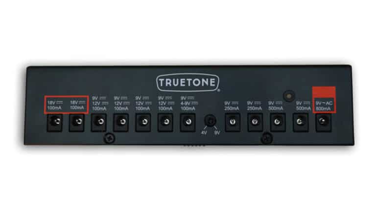 Rear shot of the Truetone CS12 pedalboard power supply displaying outputs and voltages