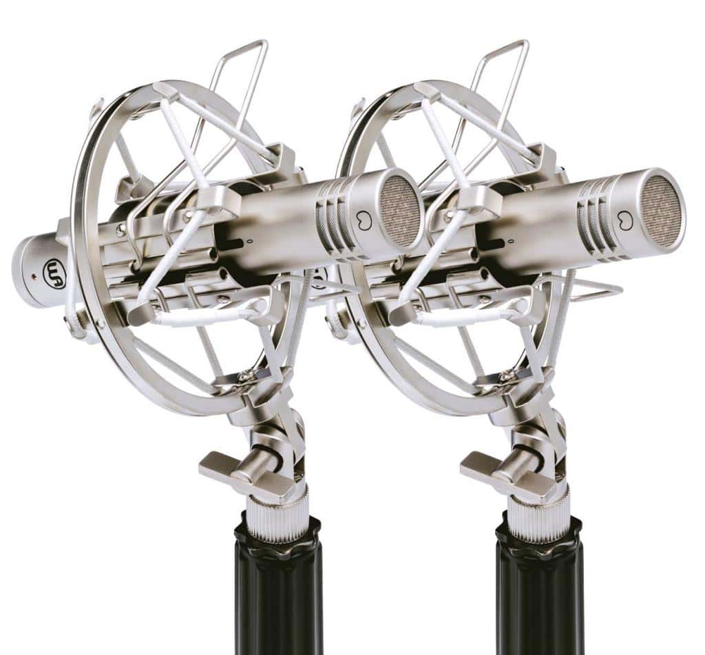 Warm Audio WA-84 stereo pair side angle in chrome finish, mounted in shockmounts on microphone stands